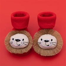 Pair of red baby anti-slip cotton socks with festive Christmas designs