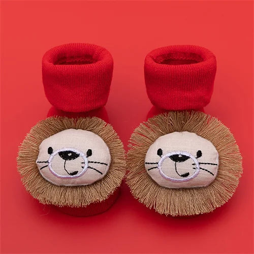 Pair of red baby anti-slip cotton socks with festive Christmas designs