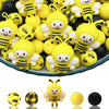A collection of yellow and black 3D bee silicone beads for DIY crafts.