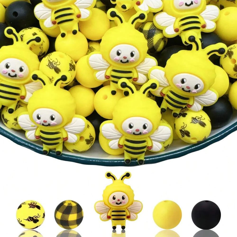 A collection of yellow and black 3D bee silicone beads for DIY crafts.