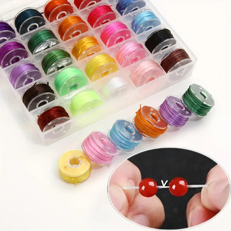 A plastic tray filled with various colored elastic beading cords and a close-up of a red crystal bead on a string.