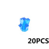 A small, translucent blue crystal or gem shaped like an abstract starburst.