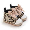 Pair of leopard print soft sole baby sneakers with light pink bow details