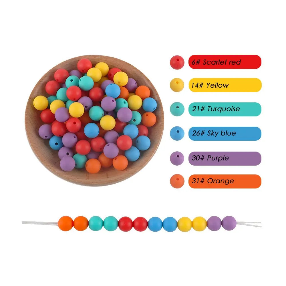 A collection of silicone round beads in various colors including scarlet red, yellow, turquoise, sky blue, purple, and orange