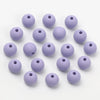 A collection of small, matte purple acrylic beads for jewelry making
