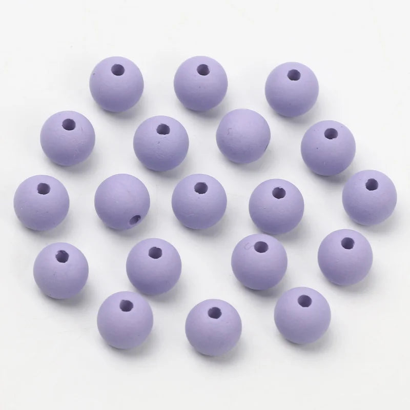 A collection of small, matte purple acrylic beads for jewelry making