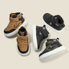 A set of three kids high-top sneakers in tan and black colors shown from the side.