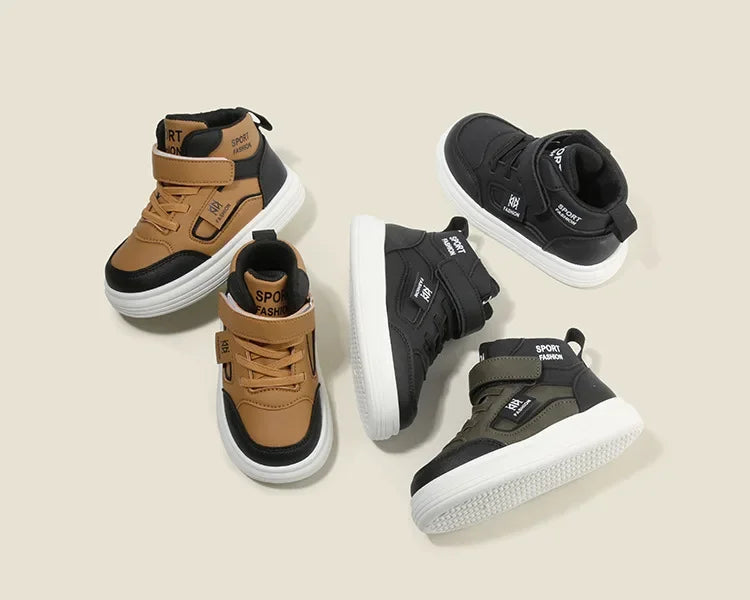 A set of three kids high-top sneakers in tan and black colors shown from the side.