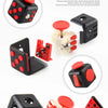 A set of black and red fidget cubes with magnetic buttons and a rotating joystick for tactile stimulation.