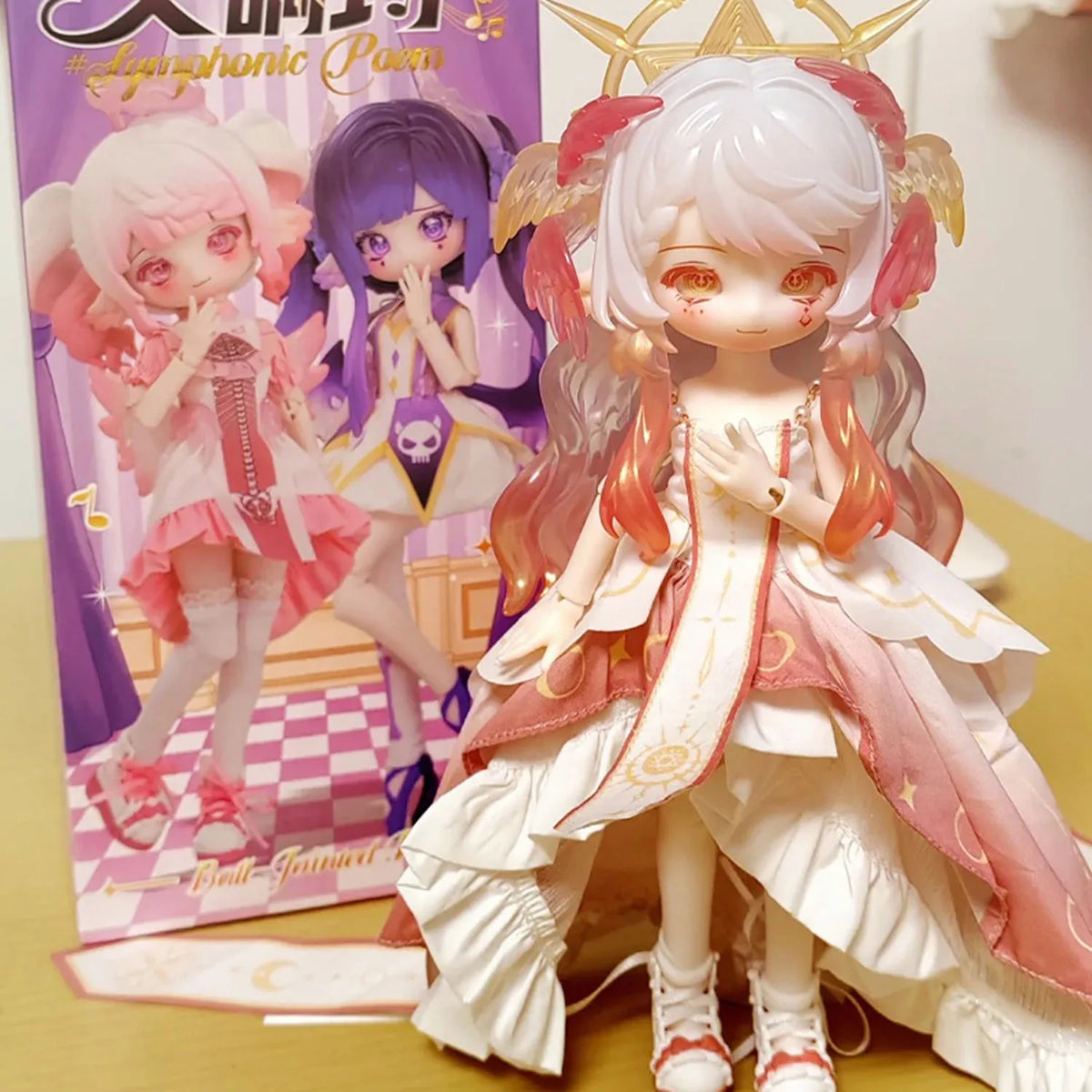 A white and pink articulated BJD doll with long hair and wings is displayed in front of its packaging.