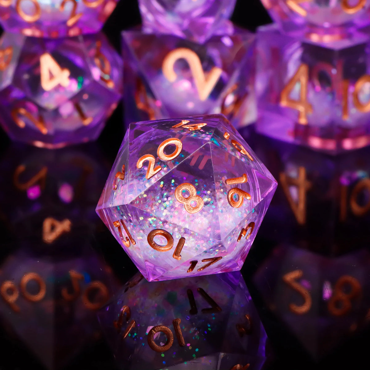 A close-up of a set of translucent purple polyhedral dice resting on a reflective surface.