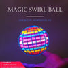 A glowing, multicolored sphere is held in a hand against a dark background.