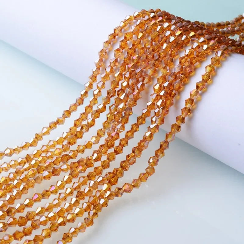 Strands of faceted amber and orange crystal beads for jewelry making