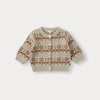 A beige knit sweater with a brown tree pattern and matching pants set for a toddler.
