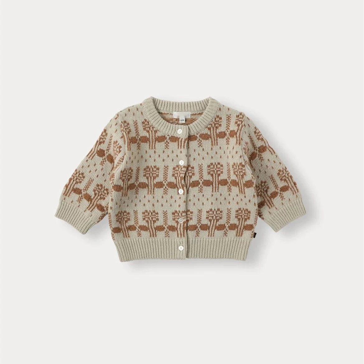 A beige knit sweater with a brown tree pattern and matching pants set for a toddler.