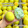 A hand holds a yellow lemon and a green handmade ball made from lemon, demonstrating the color-changing property.