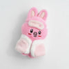 A pink and white fluffy cartoon rabbit plush keychain with pink ears and a light pink face.