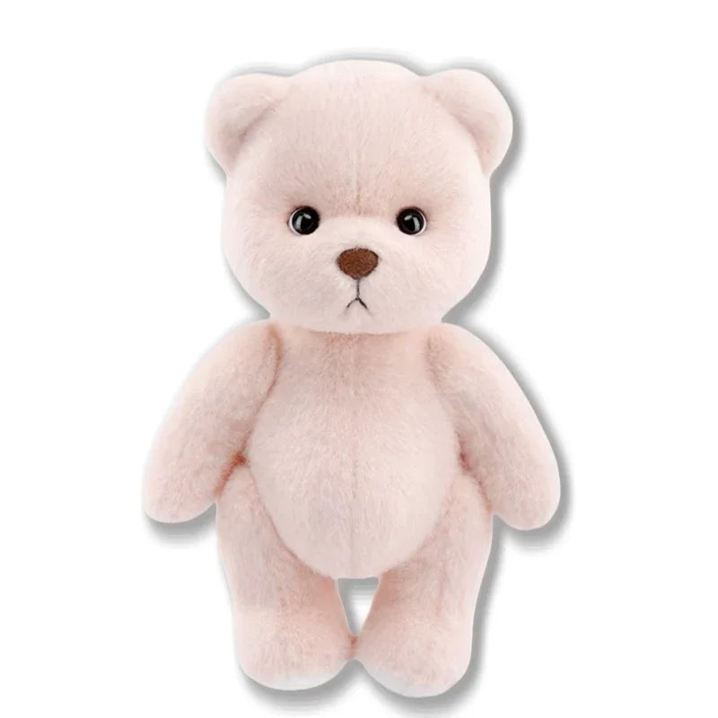 A soft pink huggable teddy bear plush toy with a brown nose and light fur.