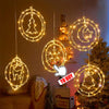 Decorative battery-powered fairy lights shaped like a Christmas tree, moon, and bell hanging on a wall.
