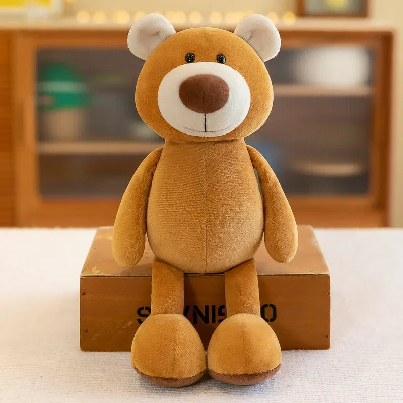 A fluffy brown teddy bear plush toy sitting on a wooden box.