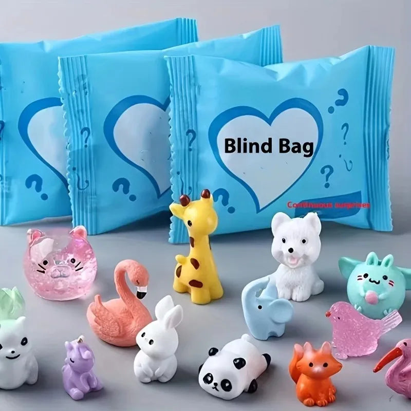 A collection of cute mini animal surprise blind bags in various colors and shapes displayed on a gray surface.