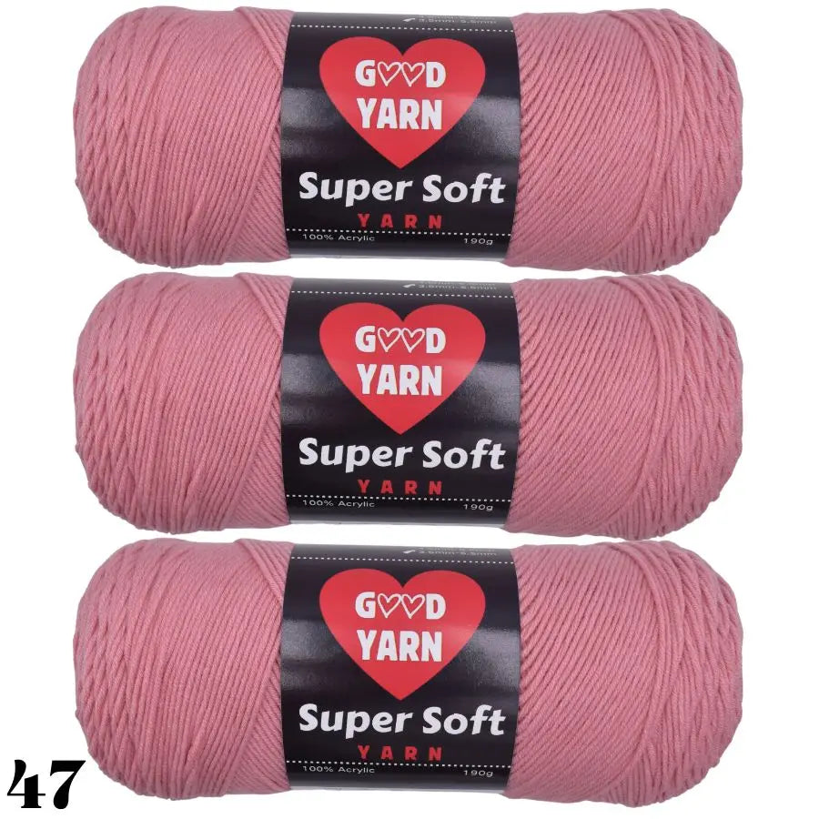 Three skeins of Super Soft pink acrylic yarn labeled GOVD YARN for crochet and knitting