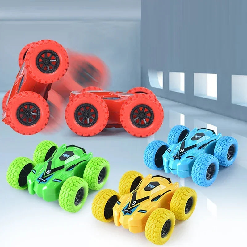 A collection of orange, green, and yellow pull-back inertia car toys with wheels and flip-over action.