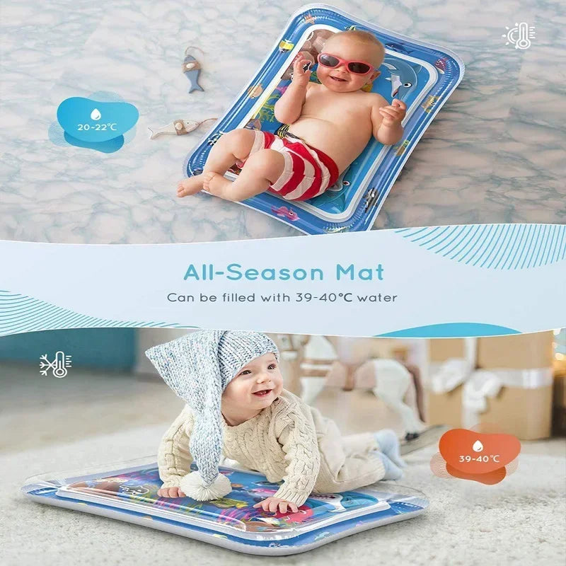 An inflatable baby water play mat is shown being used for tummy time by a smiling baby.