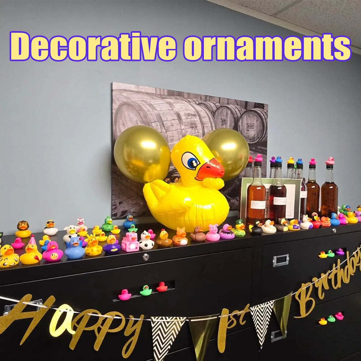 A yellow rubber duck decoration displayed on a dark shelf with decorative ornaments.