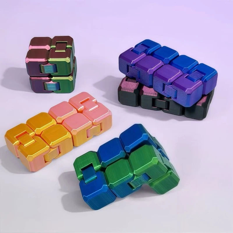 A collection of colorful Infinity Cubes fidget toys in various shades including purple, green, and orange.