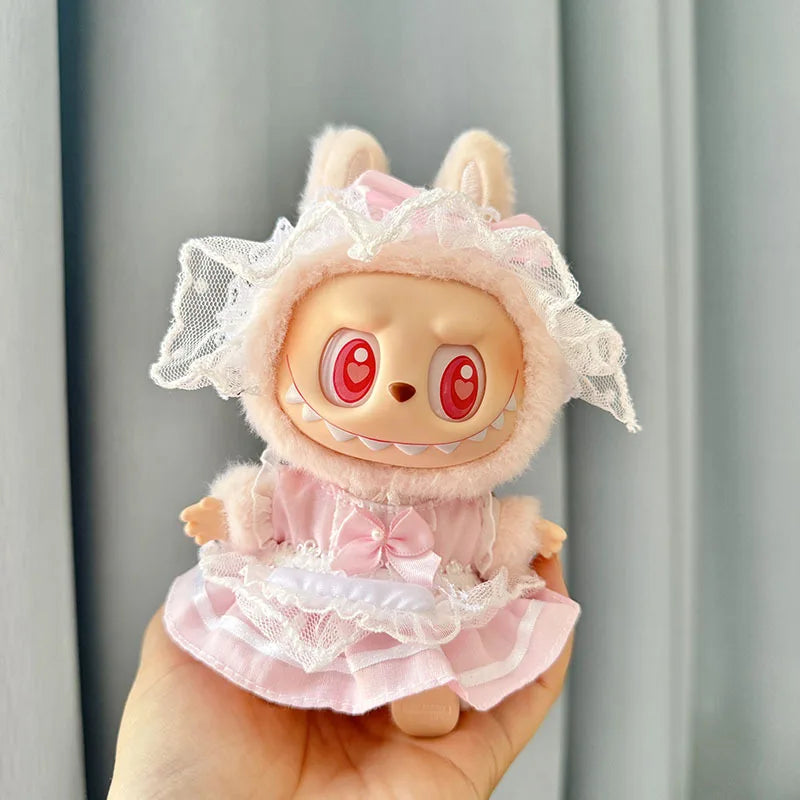 A cute pink strawberry party doll outfit featuring a fluffy pink head, lace veil, and ruffled dress.