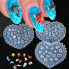 A hand displays various 3D silicone nail art molds featuring sea shell, starfish, and ocean designs.