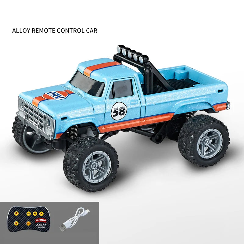 A blue and orange alloy remote control off-road toy truck with a steering wheel and battery pack.