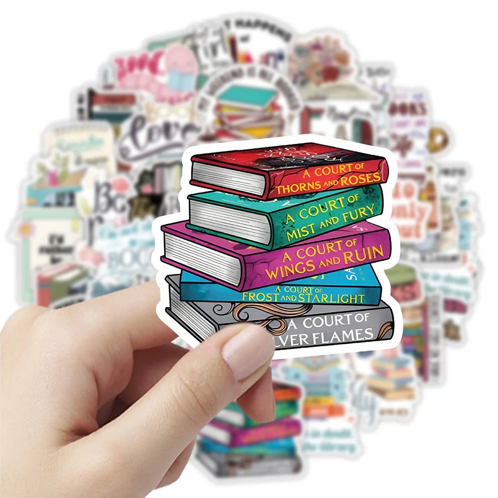 A hand holds a stack of cartoon bookworm reading stickers featuring various literary titles and illustrations.