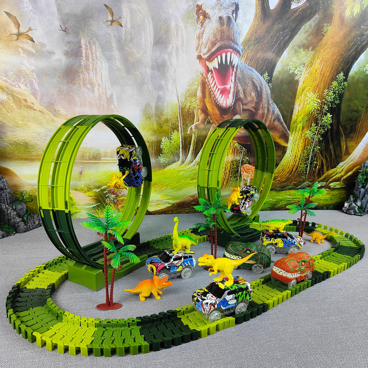 A green dinosaur climbing car track set featuring various yellow and colorful cars in a naturalistic diorama.