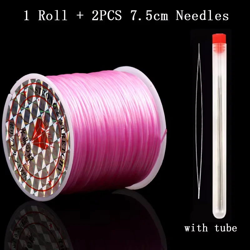 Roll of pink elastic beading cord with two 7.5cm needles and a clear tube