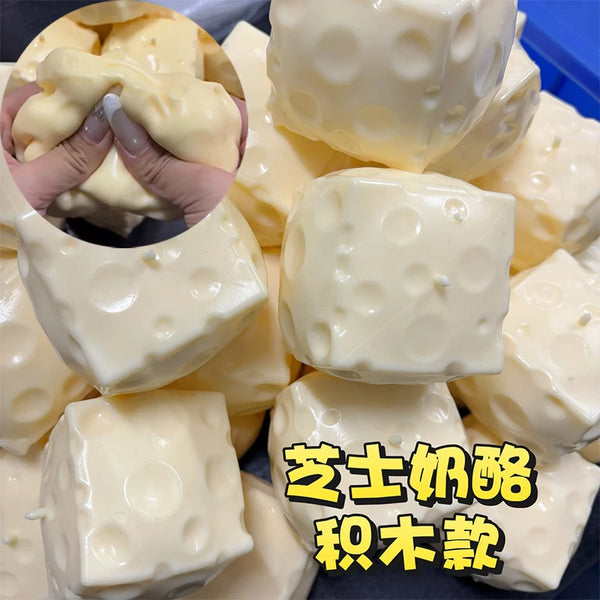 A pile of white, squishy stress balls or fidget toys are shown in various shapes and sizes.