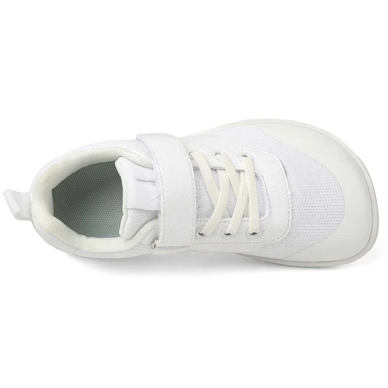 White kids barefoot training sneakers shown from the side with laces