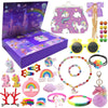 A colorful advent calendar box filled with mermaid-themed jewelry including necklaces, rings, bracelets, and a unicorn charm.