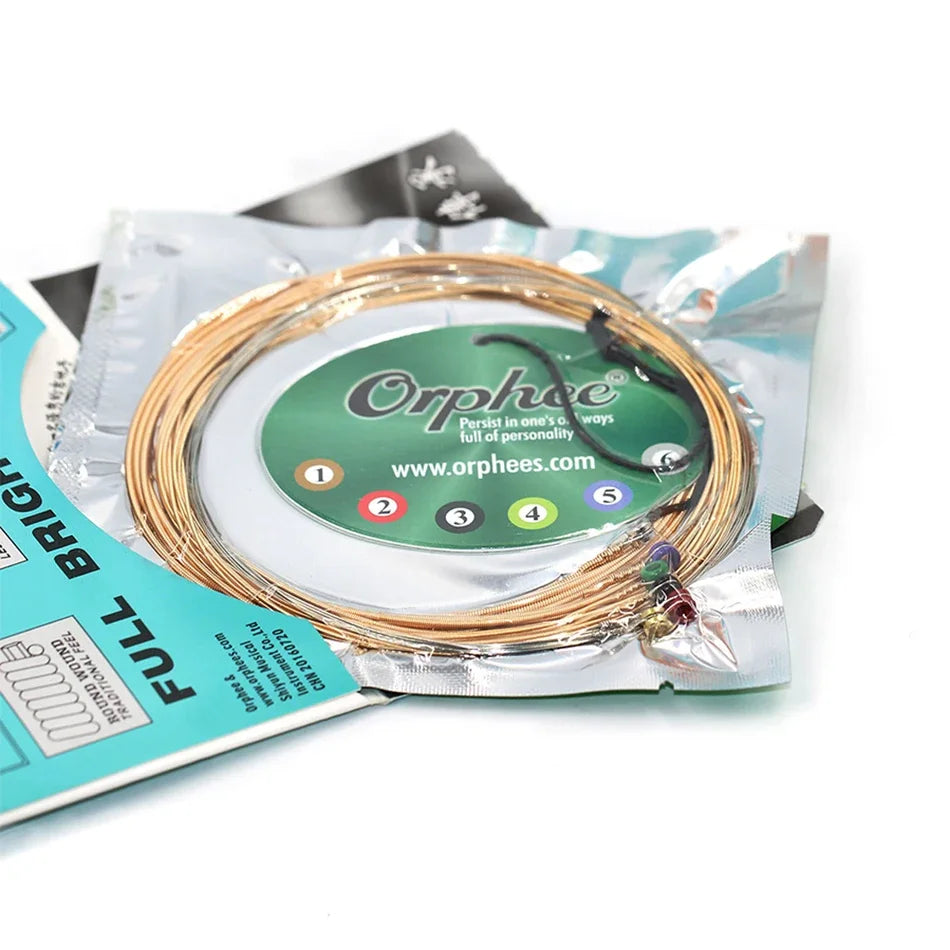 A spool of bronze acoustic guitar strings is shown inside a clear plastic bag with a green label.
