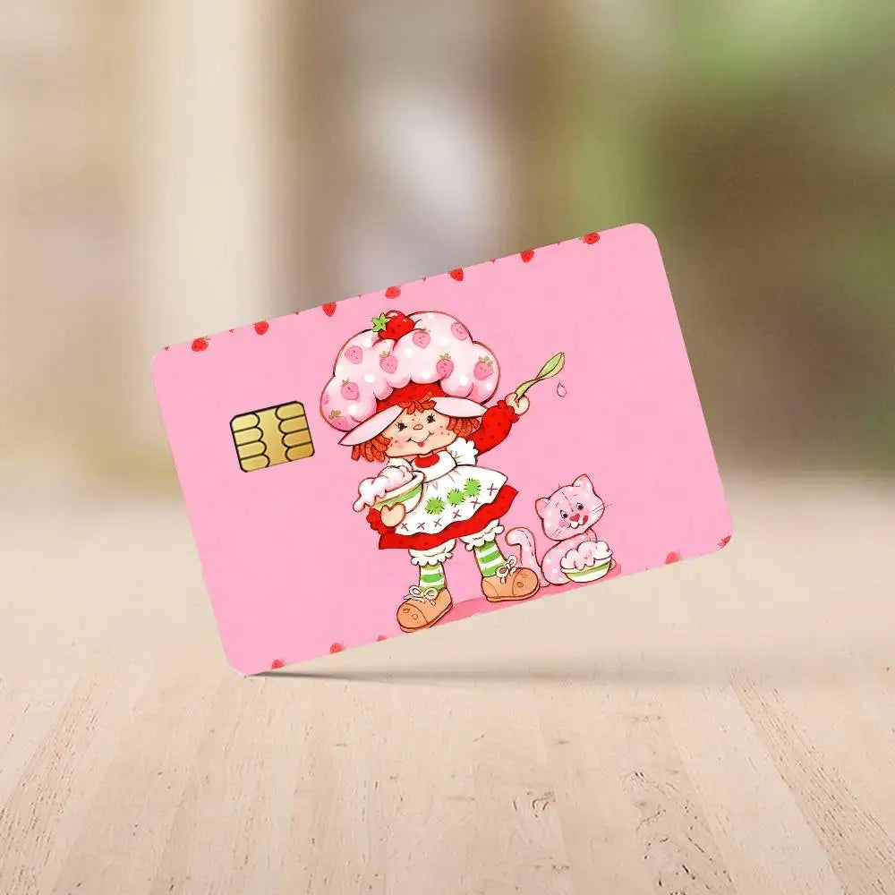 A pink credit card sticker set featuring a Strawberry Shortcake cartoon character with a pink hat and a small pink kitten.