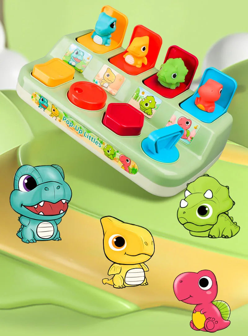 A green pop-up animal toy set featuring various colorful plastic animals for cause and effect learning.