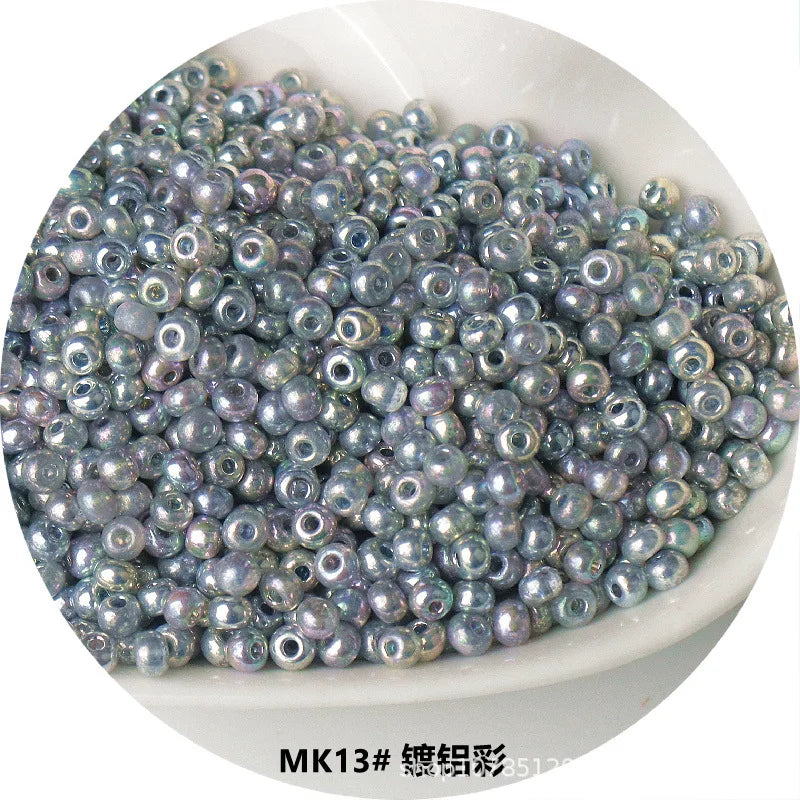 A pile of iridescent, spherical metallic glass beads used for jewelry and crafting.