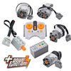 A set of Power Functions motors and servos used for building blocks, including various components and a controller.