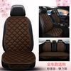 A set of three brown quilted leather car seat cushions shown in various angles for sale.
