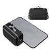 A black portable diaper bag with a gray reflective surface and a matching black organizer pouch.