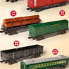 A collection of vintage steam train models including freight cars, passenger carriages, and a remote control locomotive.