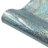 Close-up of iridescent glitter holographic heat transfer vinyl material showing a shimmering, multicolored surface.