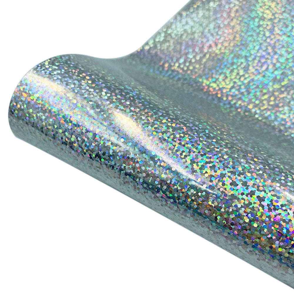Close-up of iridescent glitter holographic heat transfer vinyl material showing a shimmering, multicolored surface.
