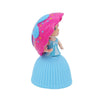 A doll with long pink hair and a light blue dress, featuring a cupcake theme.